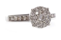 Lot 14 - DIAMOND CLUSTER RING the round bezel set with...