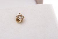 Lot 30 - SINGLE DIAMOND EARRING set with a round...