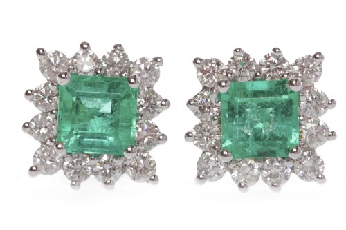 Lot 58 - PAIR OF DIAMOND CLUSTER EARRINGS set with a...
