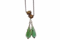 Lot 116 - GREEN HARDSTONE NECKLACE with two pear shaped...