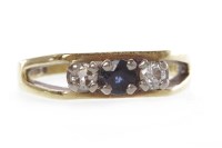 Lot 125 - SAPPHIRE AND DIAMOND RING set with a round...