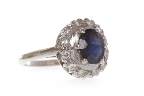 Lot 134 - SAPPHIRE AND DIAMOND CLUSTER RING the oval...