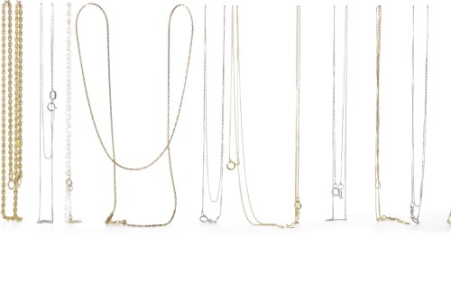 Lot 86 - GROUP OF NINE CARAT GOLD CHAINS of various...