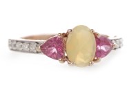 Lot 88 - OPAL AND DIAMOND RING the central opal flanked...