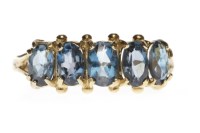 Lot 65 - GOLD PLATED BLUE GEM SET RING with five oval...