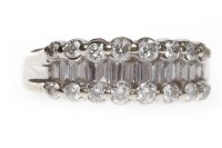 Lot 86 - DIAMOND DRESS RING with a central row of...