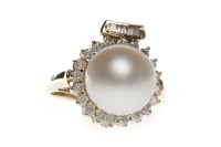 Lot 107 - PEARL AND DIAMOND DRESS RING set with a single...
