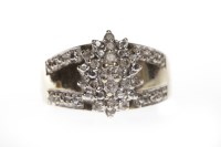 Lot 116 - NINE CARAT GOLD DIAMOND CLUSTER RING with an...