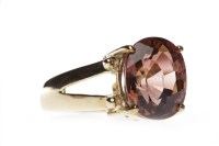 Lot 190 - TOPAZ SINGLE STONE RING set with an oval dark...