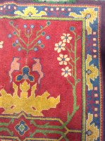Lot 567 - TURKEY BORDERED RUG decorated with a large...
