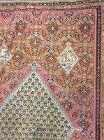 Lot 575 - KELIM BORDERED RUG decorated with a large...