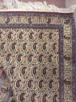 Lot 578 - KASHAN BORDERED RUG decorated with a large...