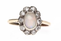 Lot 189 - OPAL AND WHITE GEM SET RING set with a central...