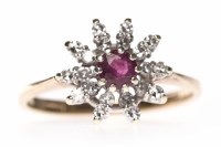 Lot 192 - NINE CARAT GOLD RUBY AND DIAMOND CLUSTER RING...