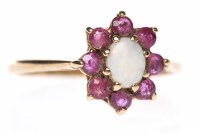 Lot 279 - RUBY AND OPAL FLORAL CLUSTER RING set with a...