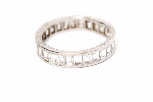 Lot 144 - DIAMOND FULL ETERNITY RING with channel set...
