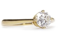 Lot 203 - DIAMOND SOLITAIRE RING the four claw set round...