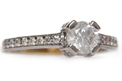 Lot 205 - DIAMOND SOLITAIRE RING the four claw set round...