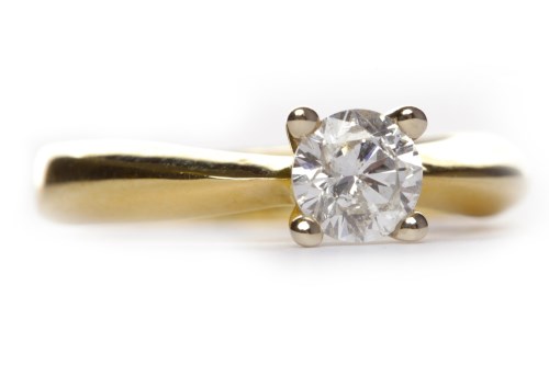Lot 221 - DIAMOND SOLITAIRE RING the four claw set round...