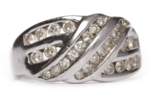 Lot 291 - DIAMOND DRESS RING with rows of channel set...