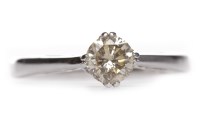 Lot 321 - DIAMOND SOLITAIRE RING the four claw set round...