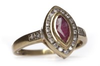 Lot 353 - RUBY AND DIAMOND RING the marquise bezel set...