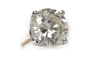 Lot 404 - SINGLE DIAMOND STUD EARRING with a four claw...