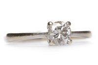 Lot 462 - DIAMOND SOLITAIRE RING the four claw set round...