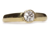 Lot 479 - DIAMOND SOLITAIRE RING the collet set round...
