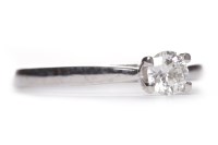 Lot 494 - DIAMOND SOLITAIRE RING the four claw set round...