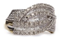 Lot 529 - NINE CARAT GOLD DIAMOND DRESS RING the knotted...