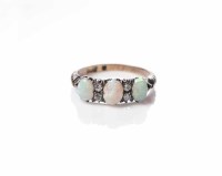 Lot 1824 - OPAL AND DIAMOND RING set with three oval...