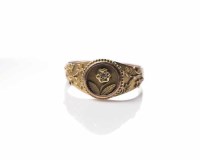 Lot 1829 - NINE CARAT GOLD MOURNING RING of floral design,...