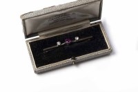 Lot 1851 - RUBY AND DIAMOND BAR BROOCH set centrally with...