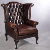 Lot 903 - OXBLOOD LEATHER WINGBACK ARMCHAIR by Connolly...