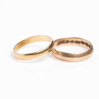 Lot 1879 - TWO GOLD WEDDING BANDS one in eighteen carat...