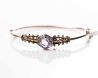 Lot 1891 - EDWARDIAN NINE CARAT GOLD AMETHYST BANGLE set...