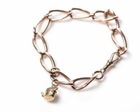 Lot 1892 - NINE CARAT GOLD CURB LINK BRACELET with a...