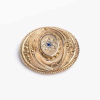 Lot 1905 - VICTORIAN SAPPHIRE BROOCH of oval form, with a...