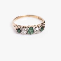 Lot 1916 - EMERALD AND DIAMOND FIVE STONE RING set with a...