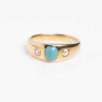 Lot 1918 - TURQUOISE AND DIAMOND THREE STONE RING with a...