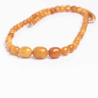 Lot 1928 - BUTTERSCOTCH AMBER BEAD NECKLACE formed of...