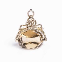 Lot 1936 - CITRINE SET FOB with a faceted citrine, on an...