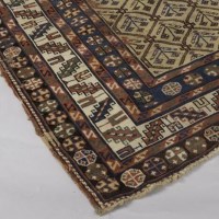 Lot 921 - CAUCASIAN BORDERED RUG decorated with a...
