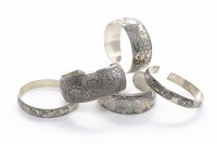 Lot 880 - FIVE 20TH CENTURY CHINESE SILVER BANGLES...