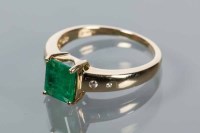 Lot 1694 - EMERALD AND DIAMOND RING set with a step cut...