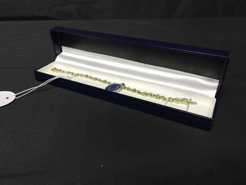 Lot 23 - SILVER AND PERIDOT BRACELET with opal pendant