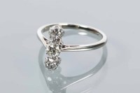 Lot 1708 - DIAMOND THREE STONE RING vertically set with...