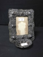 Lot 115 - UPRIGHT PHOTOGRAPH FRAME with embosed silver...