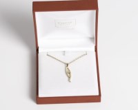 Lot 1723 - NINE CARAT GOLD DIAMOND PENDANT of twisted...